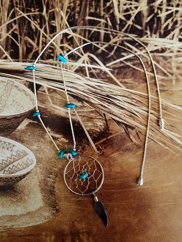 Sterling silver and turquoise dreamcatcher necklace.